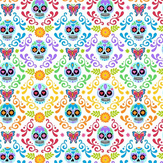 Day of the Dead Mariposas in Day features intricately detailed small sugar skulls surrounded by rainbow flourishes on a white background. The rainbow gradient transitions from one color to the next along the length of the fabric.