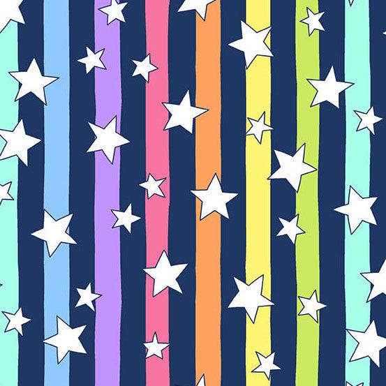 Believe Shooting Stars in Navy features white stars tossed across a dark blue and rainbow-striped background. The stripes run parallel to the selvage edge.