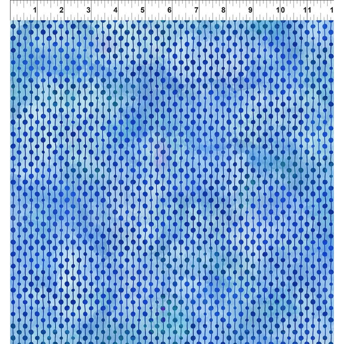 Cobalt blue and aqua fabric with repeating dotted rows with a ruler at the top indicating scale.