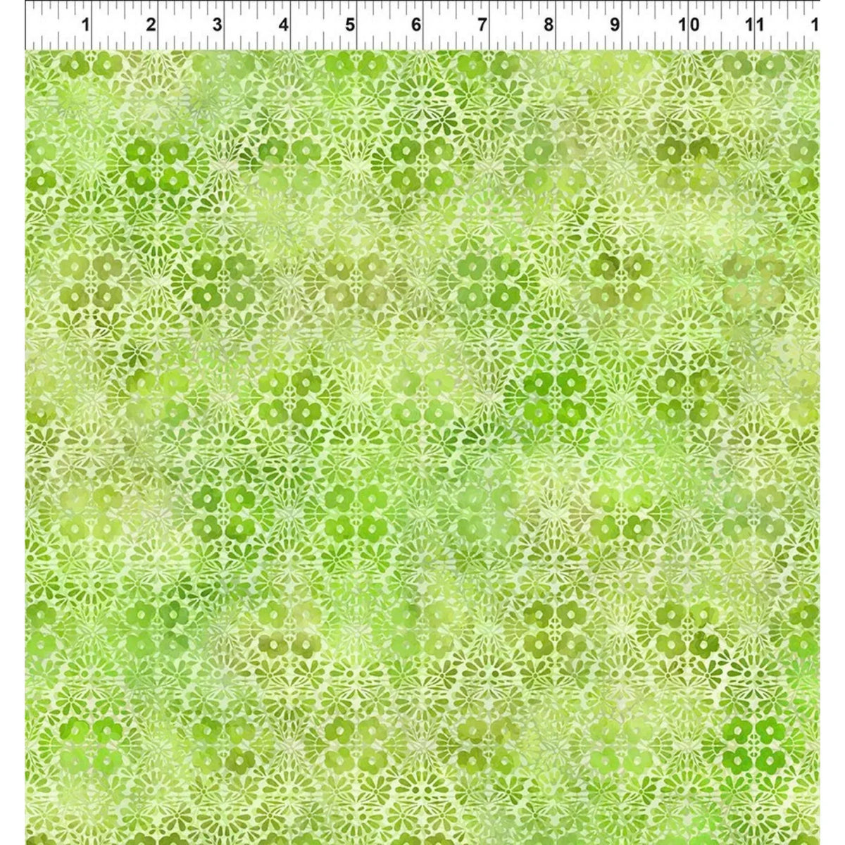 A fabric swatch featuring graceful geometric diamonds of tiny flower clusters and leafy sprigs in vibrant lime and lush green with a ruler at the top indicating scale.