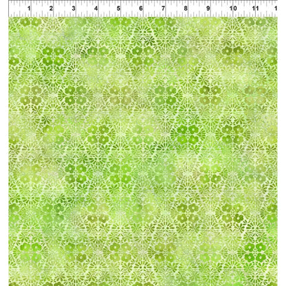 A fabric swatch featuring graceful geometric diamonds of tiny flower clusters and leafy sprigs in vibrant lime and lush green with a ruler at the top indicating scale.