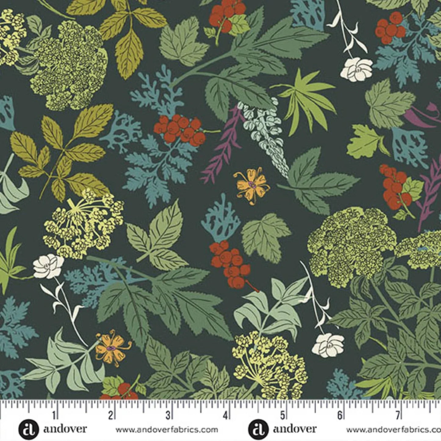 A close-up of a fabric pattern featuring a botanical design with green, blue, yellow, and red flowers and leaves on a dark charcoal background, with a ruler at the bottom showing scale.