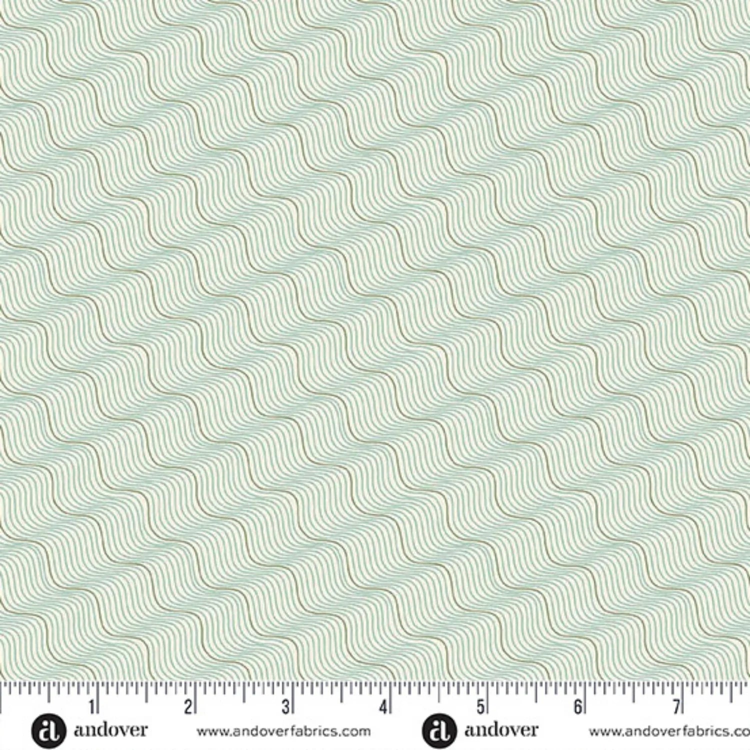 A repeating pattern of wavy diagonal lines in muted sage green and tan on a very light off-white background. Ruler at the bottom for scale.