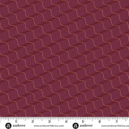 A repeating pattern of wavy diagonal lines in rose gold and black on a rich burgundy-red background. Ruler at the bottom for scale.
