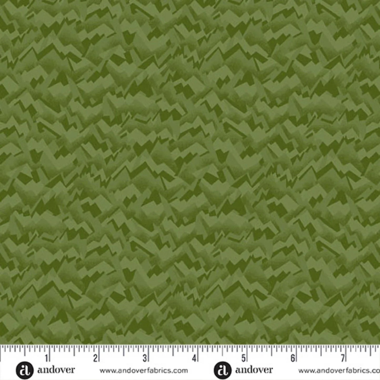 An abstract, fragmented and jagged texture in layered shades of pale olive, chartreuse, and evergreen. Ruler at the bottom for scale.