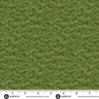An abstract, fragmented and jagged texture in layered shades of pale olive, chartreuse, and evergreen. Ruler at the bottom for scale.