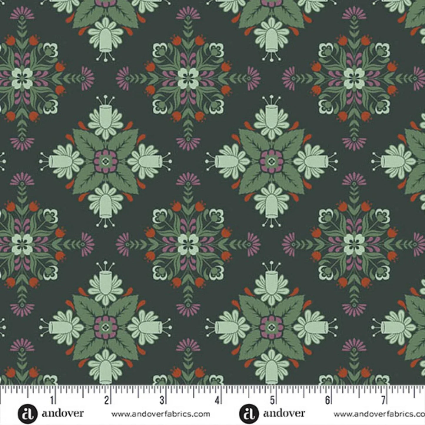 A repeating fabric pattern featuring a bold, symmetrical folk-art medallion design with intricate floral and leaf motifs in soft sage, purple, red, and cream on a deep forest-green background. Ruler at the bottom for scale.