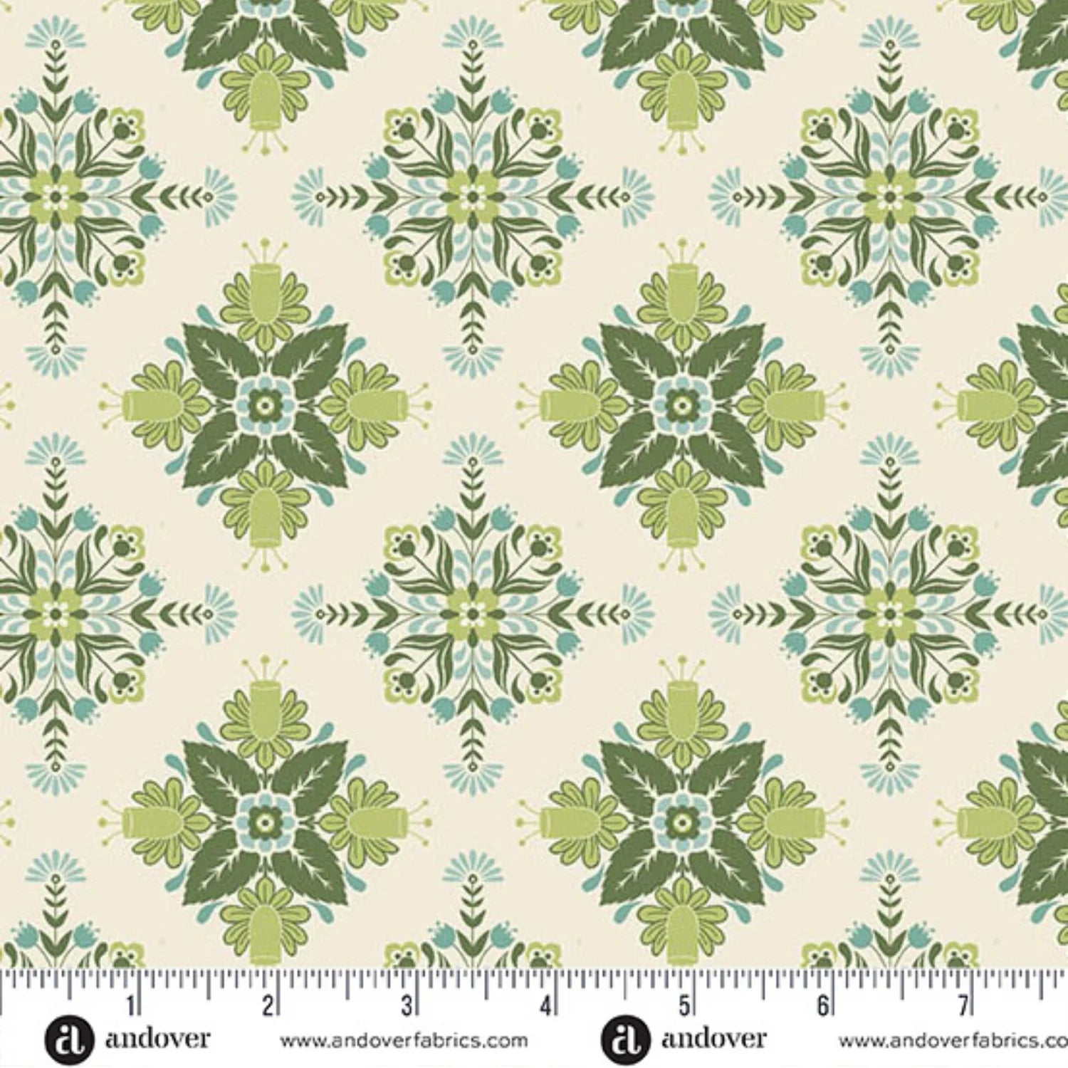 A repeating fabric pattern featuring a bold, symmetrical folk art medallion design with intricate floral and leaf motifs in soft sage, teal, and dark green on a warm cream background. Ruler at the bottom for scale.