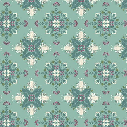 A bold, symmetrical folk art medallion design featuring intricate floral and leaf motifs in dark teal, purple, olive, and cream on a soft teal-blue background.