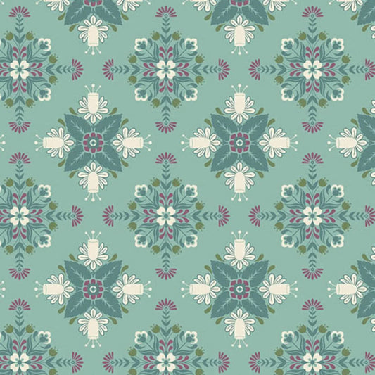 A bold, symmetrical folk art medallion design featuring intricate floral and leaf motifs in dark teal, purple, olive, and cream on a soft teal-blue background.