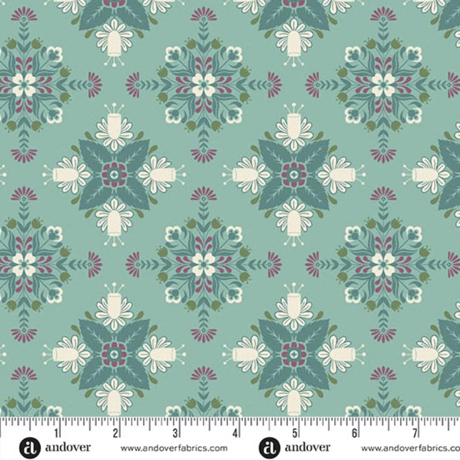 A repeating fabric pattern featuring a bold, symmetrical folk art medallion design with intricate floral and leaf motifs in dark teal, purple, olive, and cream on a soft teal-blue background. Ruler at the bottom for scale.
