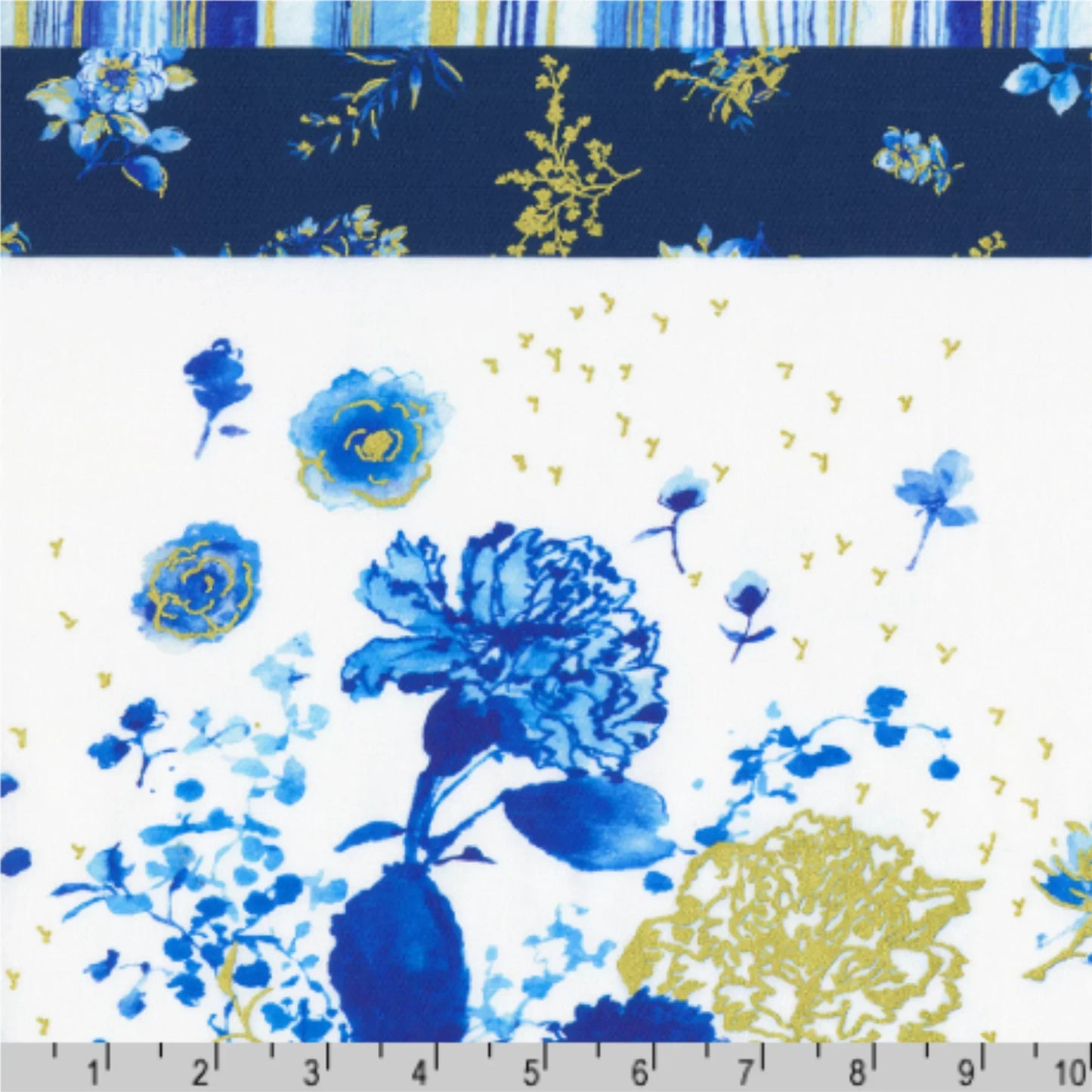 Floral fabric pattern with blue and gold flowers on a white background, with a ruler at the bottom for scale.
