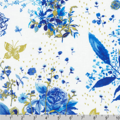 Pattern of blue flowers and gold butterflies on a white background with a ruler for scale
