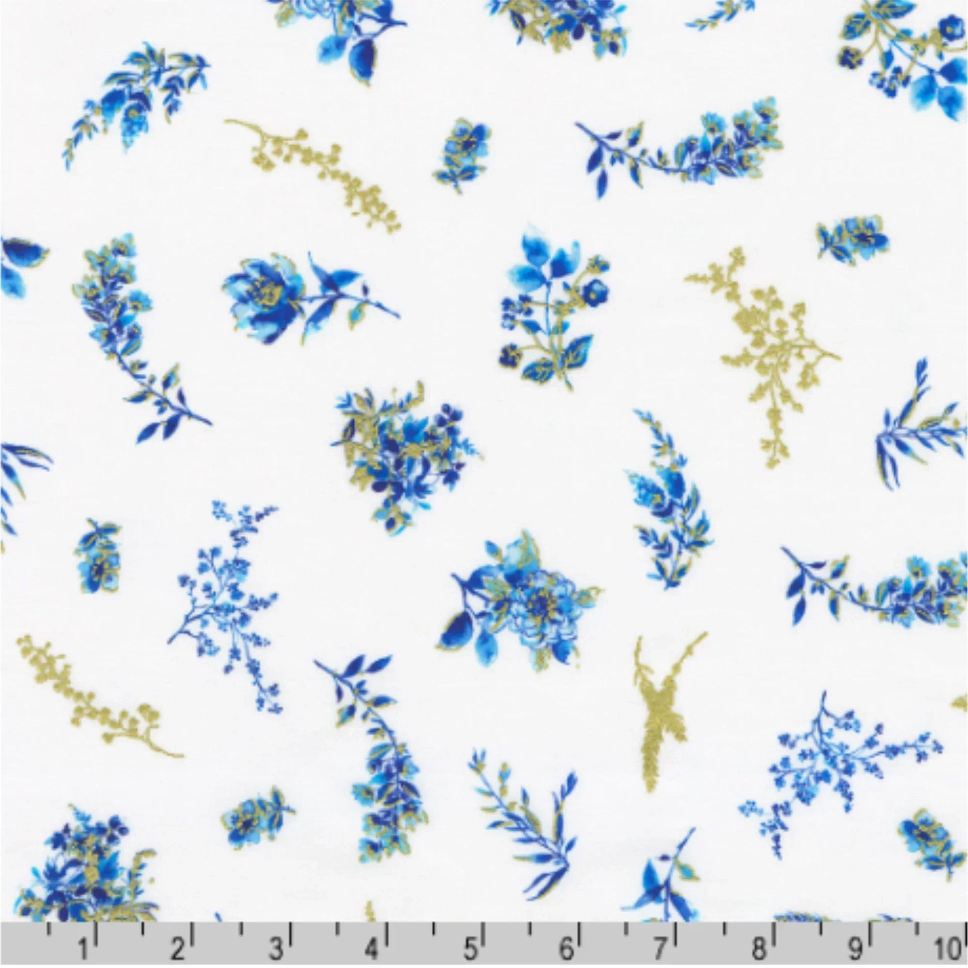 Pattern of blue and gold floral designs on a white background with a ruler for scale