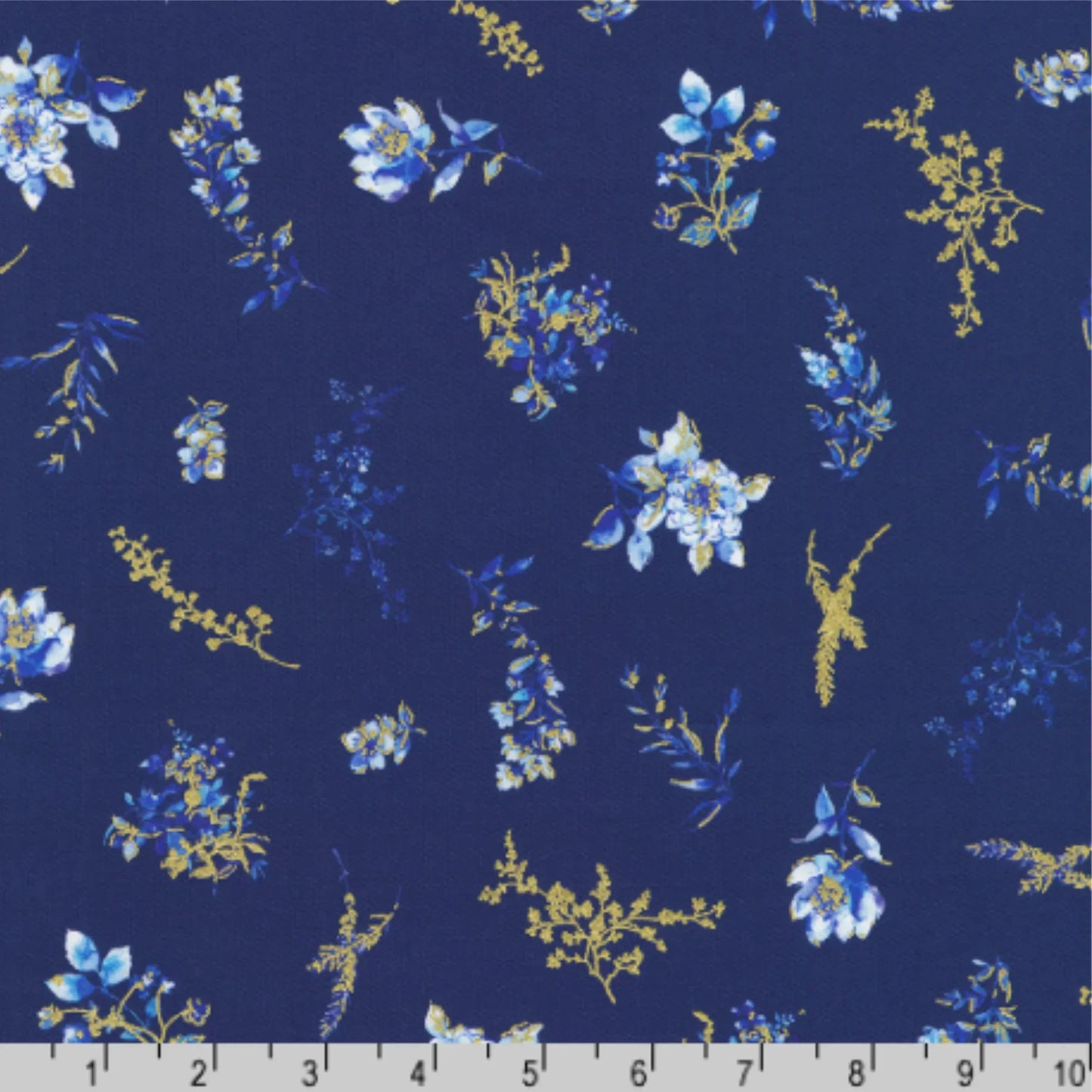 Floral pattern with blue and gold flowers on a dark blue background with a ruler for scale
