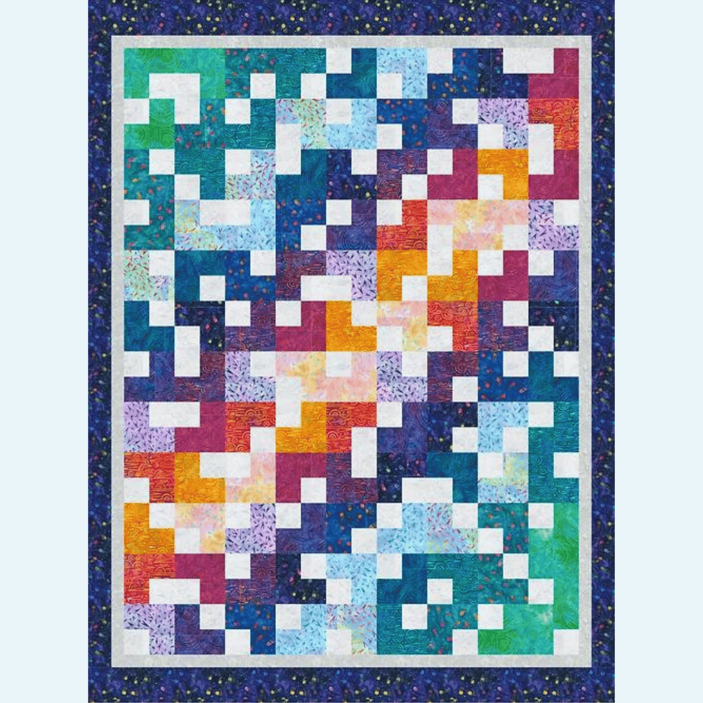 This Ambling Quilt sample features simple patchwork squares and rectangles in a colorful orange, purple, blue, and green gradient.