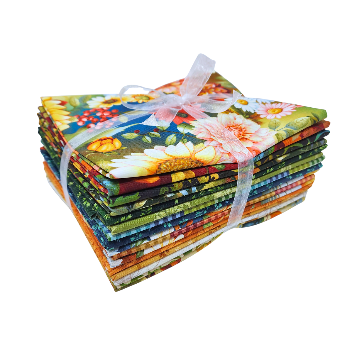 A stack of colorful fabric bundles tied together with a sheer white ribbon, featuring a vibrant floral and botanical print with sunflowers, daisies, and green leaves.