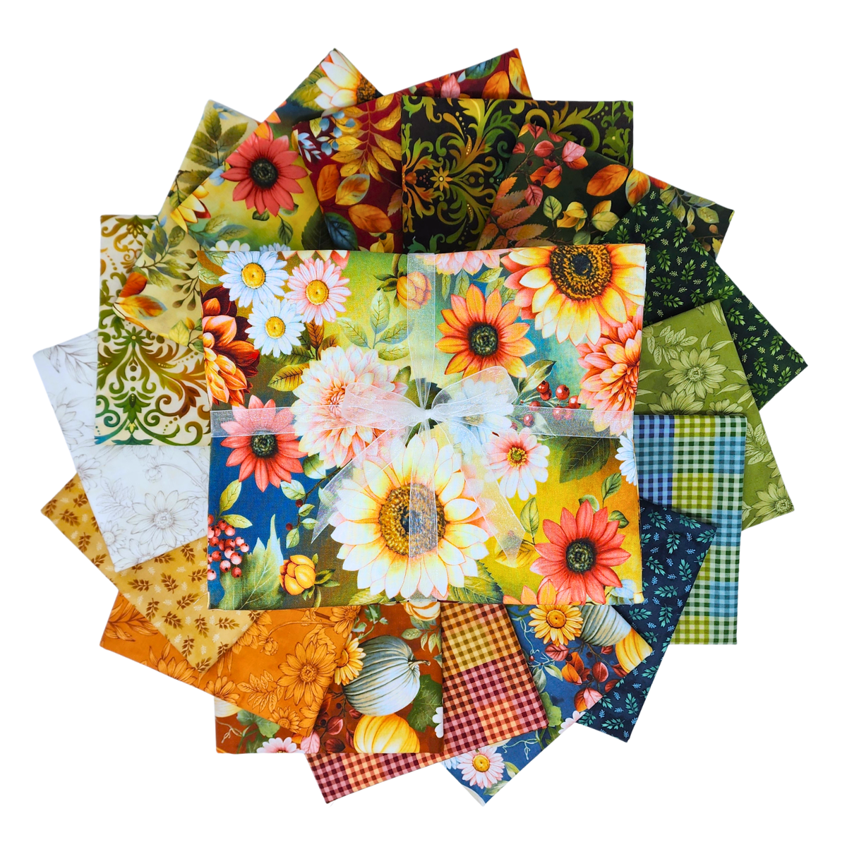 A circular arrangement of fabric squares in assorted prints, including florals, gingham, pumpkins, and leaves, rendered in a palette of beige, blue, gold, green, teal, red, and orange. 