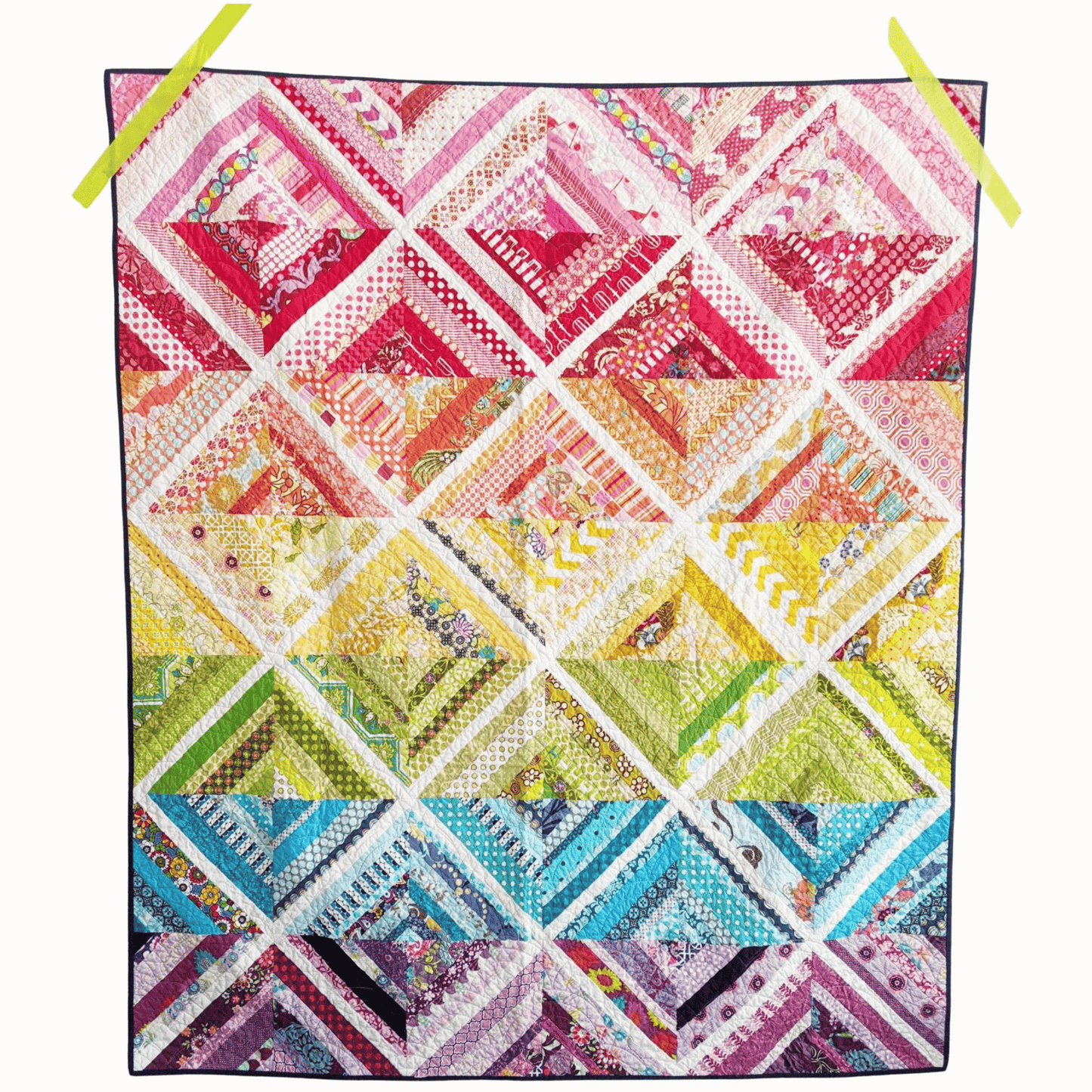 The Biased Quilt Pattern makes a fun strip quilt that is a great stash-buster! Sew various sized strips together to make scrappy blocks that look like they were sewn on-point. 