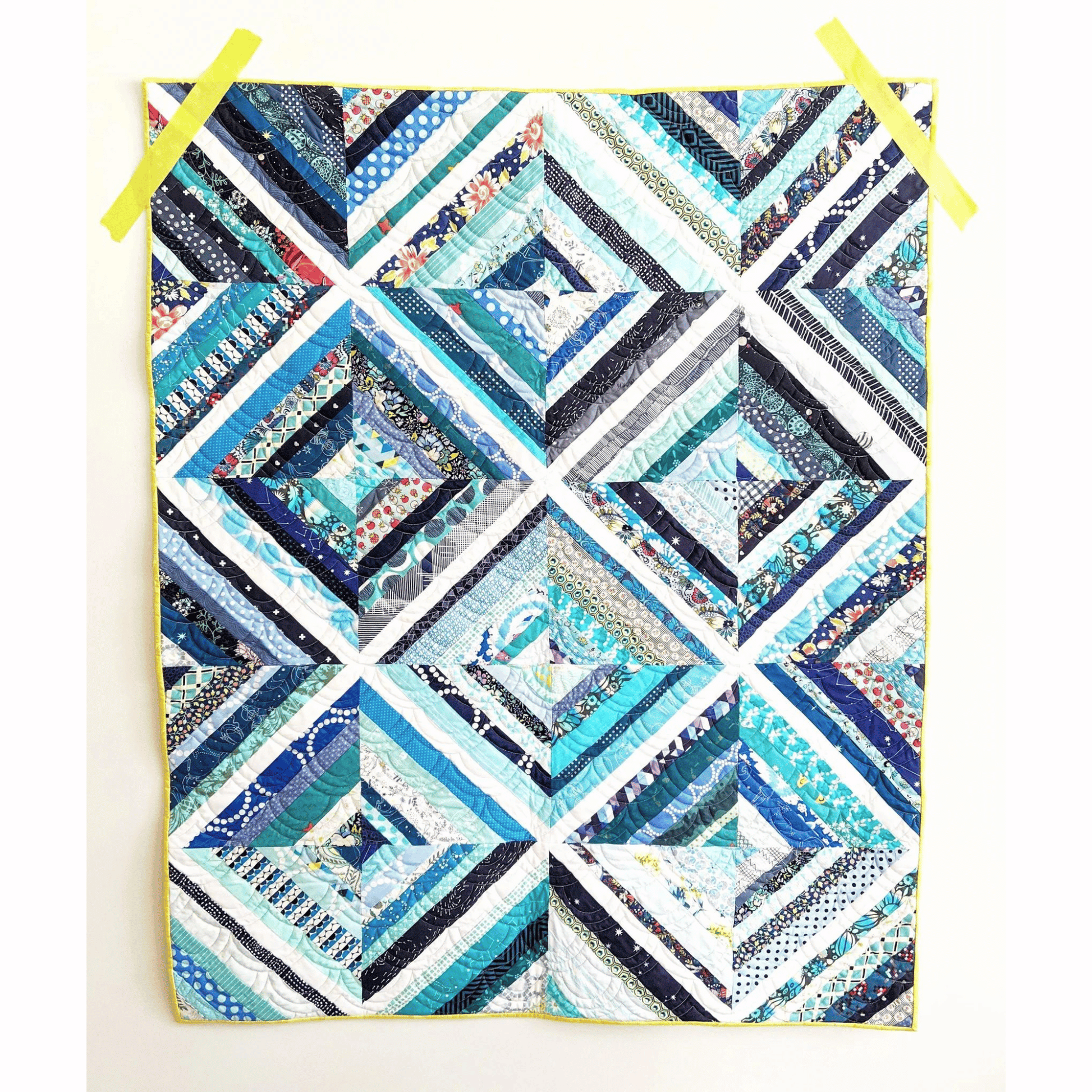 The Biased Quilt Pattern makes a fun strip quilt that is a great stash-buster! Sew various sized strips together to make scrappy blocks that look like they were sewn on-point. 