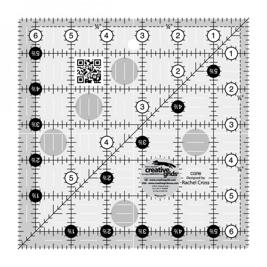 This Creative Grids 6 1/2" Square Quilt Ruler features easy-to-read black and white markings printed in 1" grids marked in 1/8" and 1/4" increments.