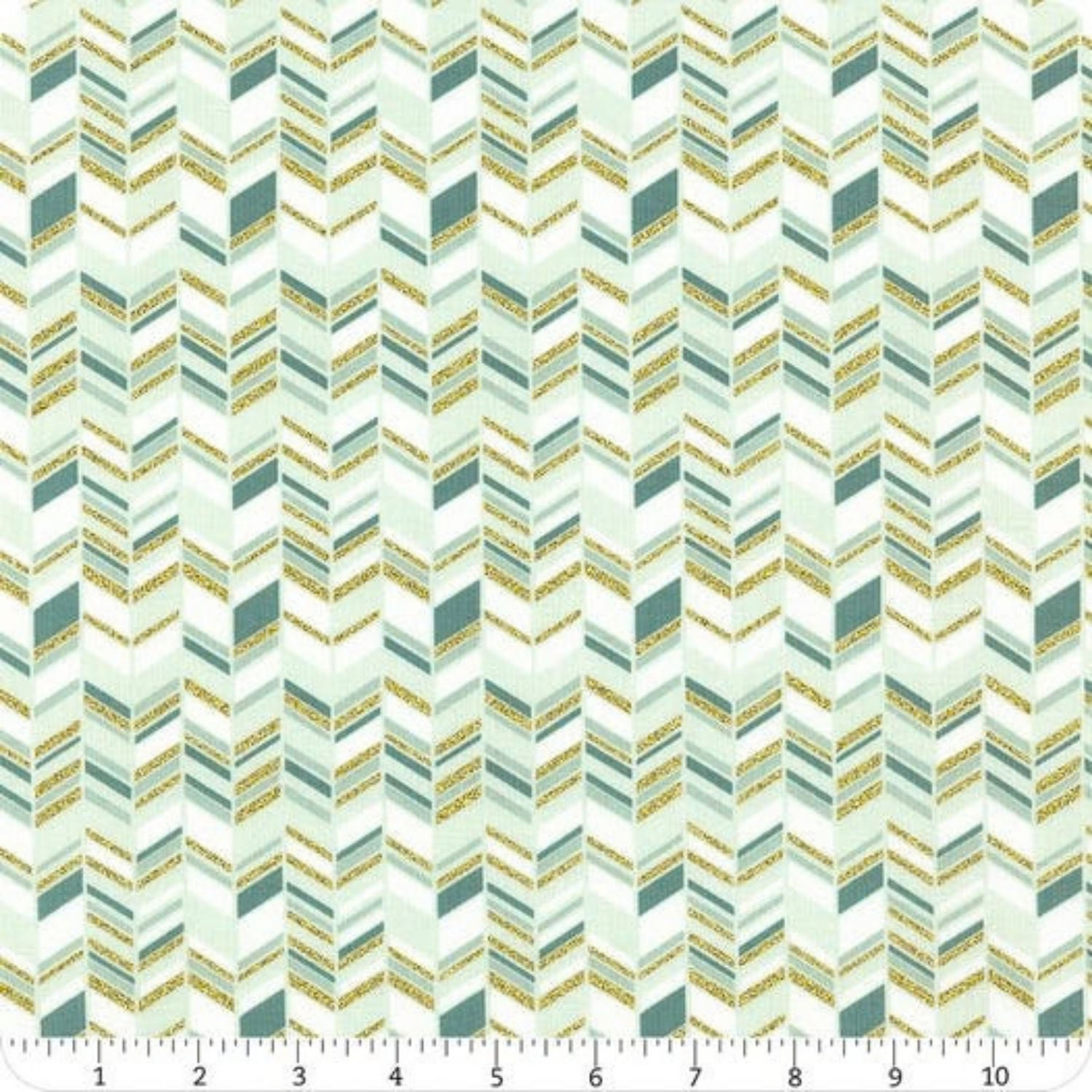 Patterned fabric with a zigzag design in teal and gold tones with ruler for scale