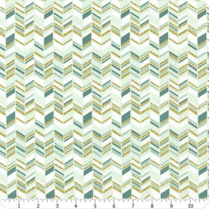 Patterned fabric with a zigzag design in teal and gold tones with ruler for scale