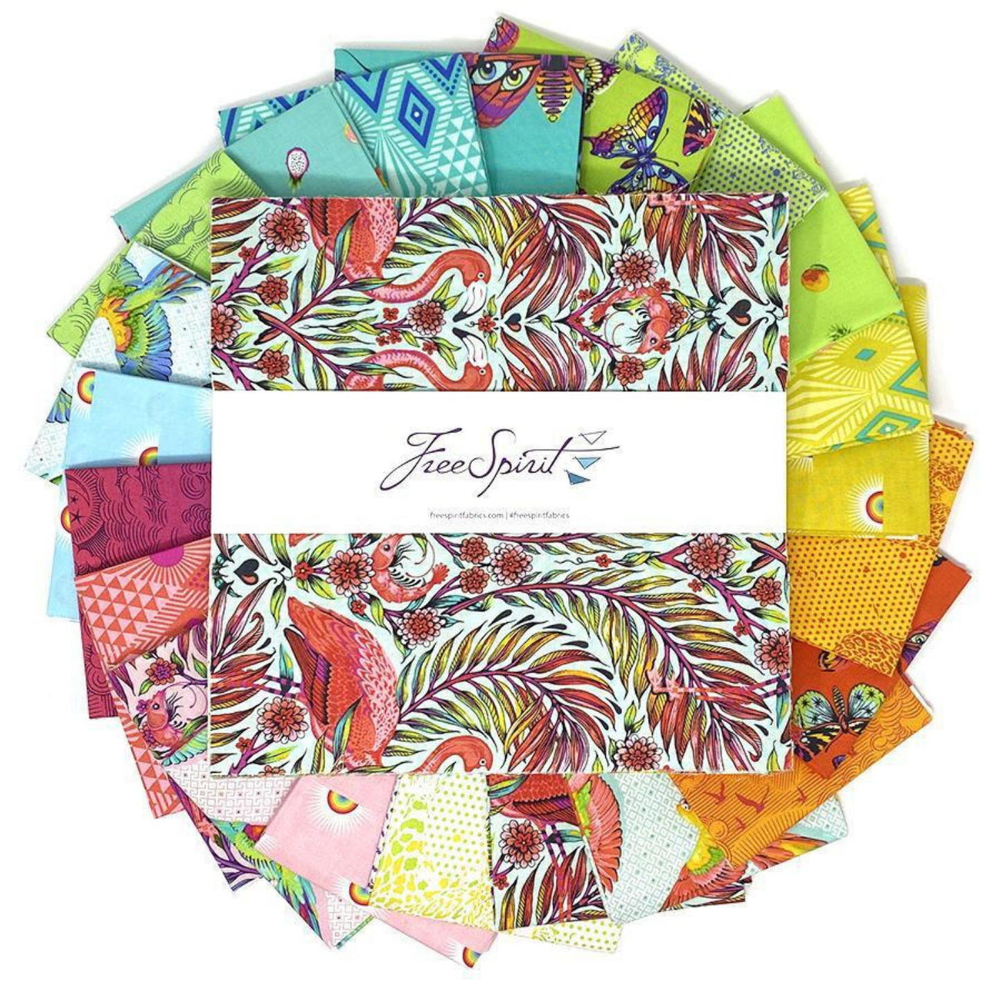 Collection of colorful fabric squares arranged in a circle with a layer cake in the center
