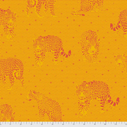 Pattern of orange jaguars on a yellow background with a ruler for scale