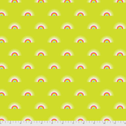 Pattern of rainbows on a yellow background with a ruler for scale