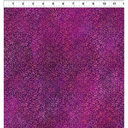 A fabric design featuring overlapping lotus blooms, awash in blended shades of deep magenta and sumptuous purple hues with a ruler at the top for scale.