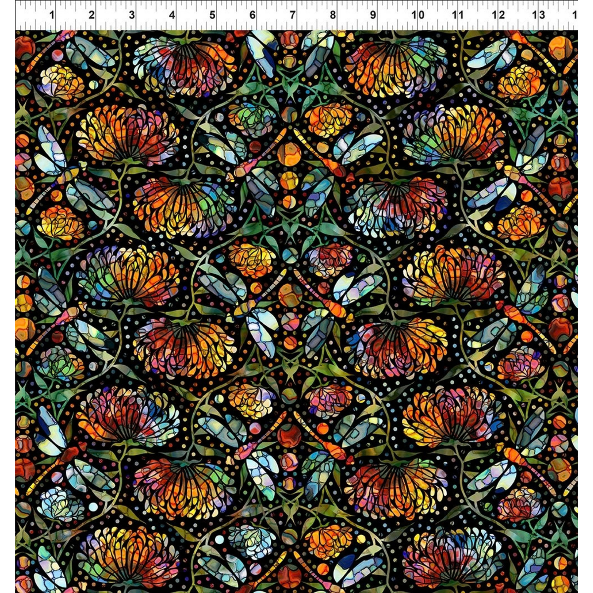 A repeating stained-glass-style floral and dragonfly pattern with orange, yellow, blue, green, and red sections outlined in black, arranged in a symmetrical decorative layout. Ruler at the top for scale.