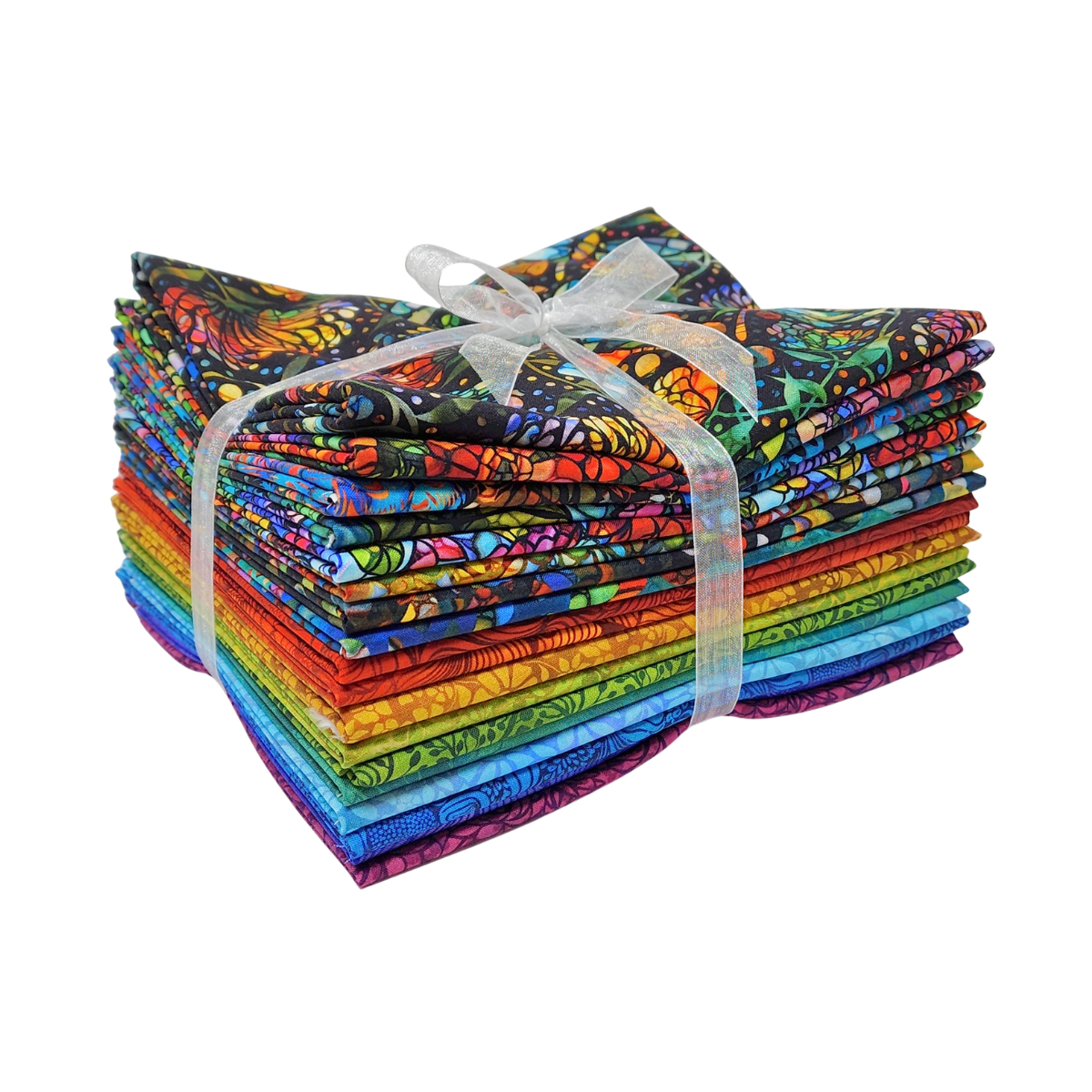 A stack of colorful fabric swatches featuring stained-glass floral designs tied with a white ribbon.