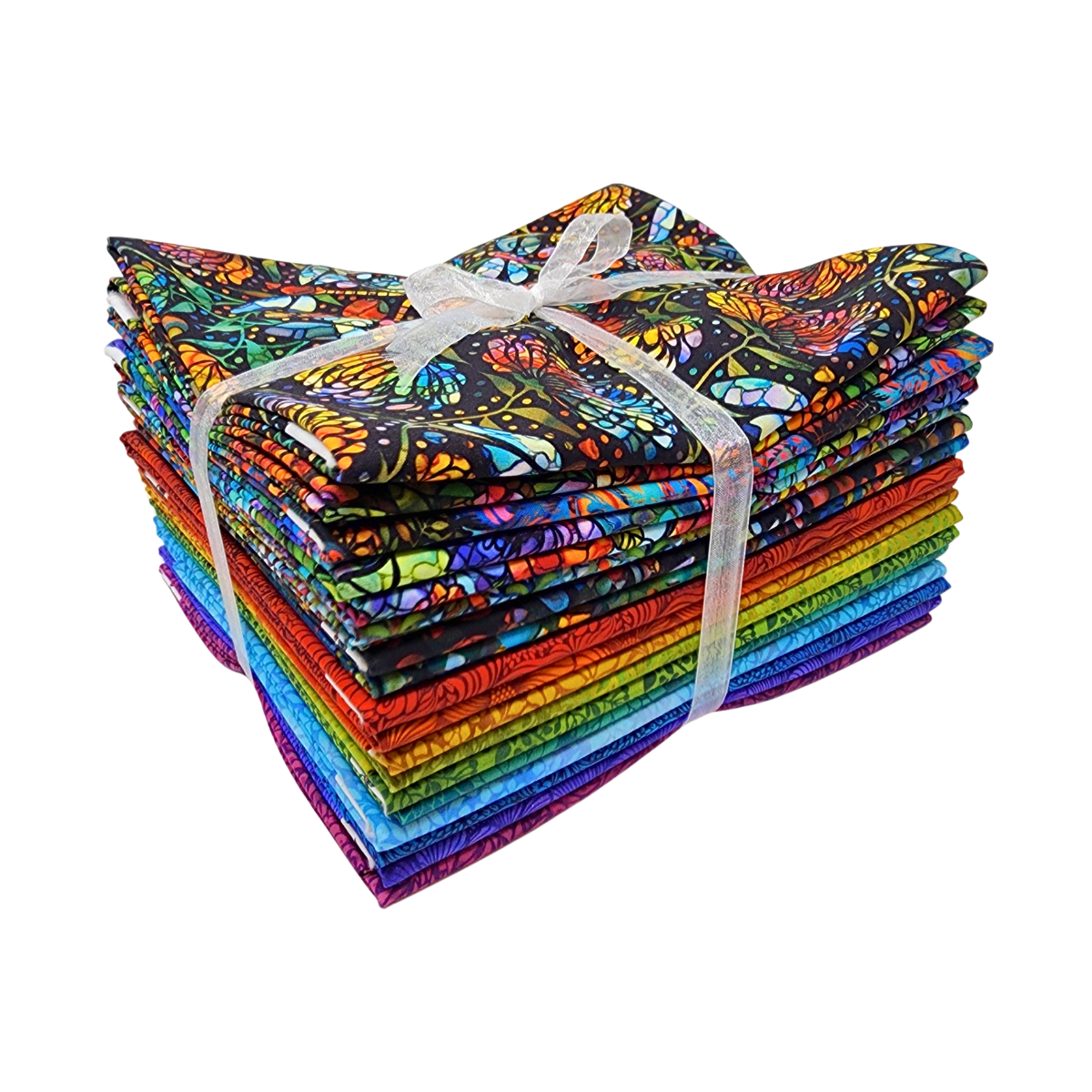 A stack of colorful fabric swatches featuring stained-glass floral designs tied with a white ribbon.