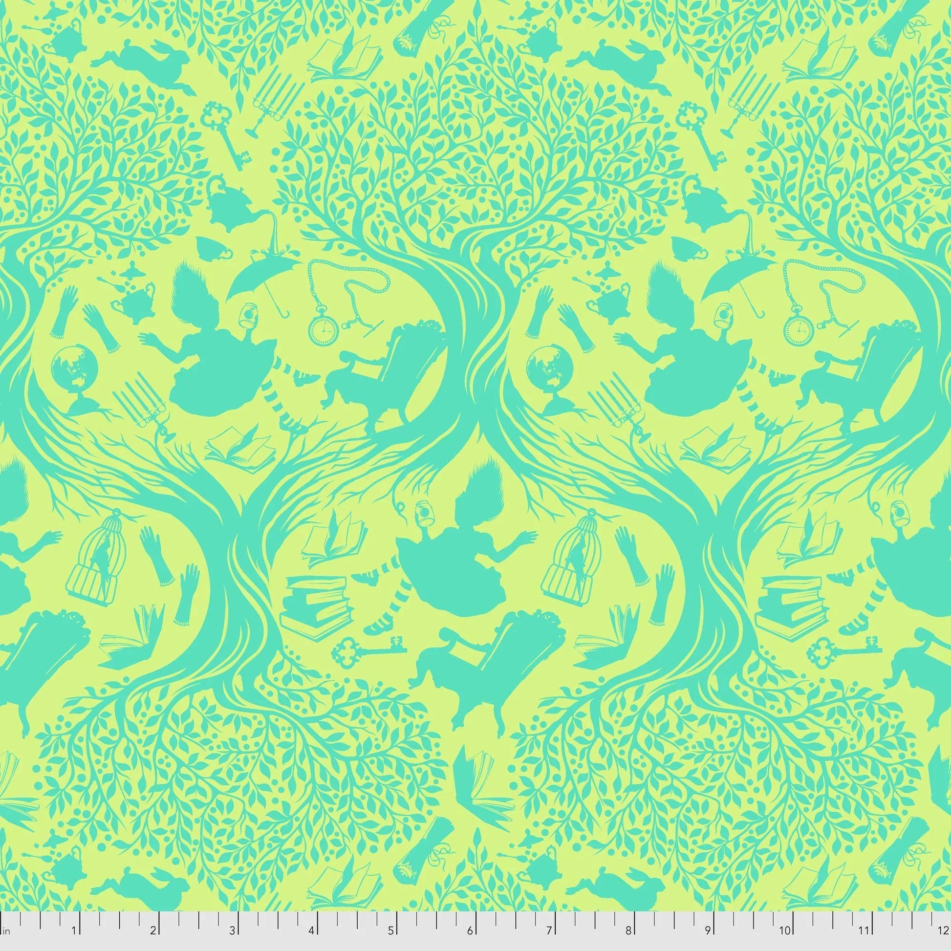 Patterned fabric with green and yellow toile design of Alice falling into Wonderland. Ruler for scale