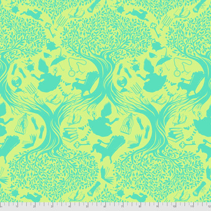 Patterned fabric with green and yellow toile design of Alice falling into Wonderland. Ruler for scale