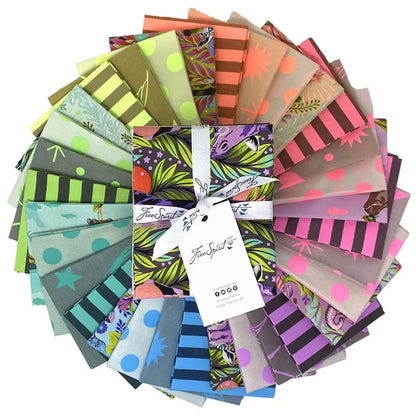 Collection of colorful fabric swatches arranged in a circle with a fat quarter bundle in the center.
