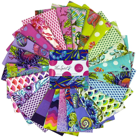 A fanned-out bundle of colorful fabric squares in vivid purples, greens, pinks, and blues, featuring aquatic and floral designs with a Charm Pack in the center.