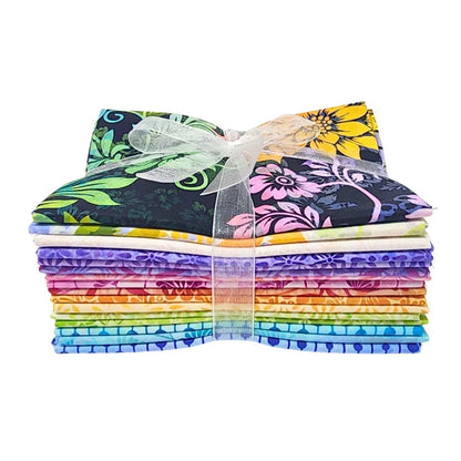A stack of colorful fabric swatches featuring vibrant floral designs tied with a white ribbon.
