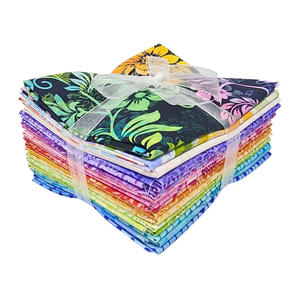 A stack of colorful fabric swatches featuring vibrant floral designs tied with a white ribbon.