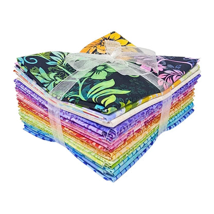 A stack of colorful fabric swatches featuring vibrant floral designs tied with a white ribbon.