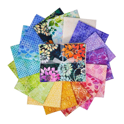 Circular arrangement of colorful fabric swatches featuring vibrant floral designs with a bundle tied with a white ribbon in the center.