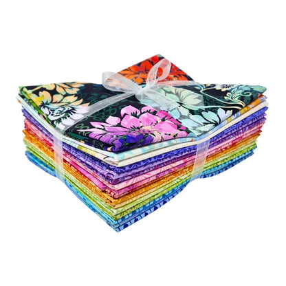 A stack of colorful fabric swatches featuring vibrant floral designs tied with a white ribbon.
