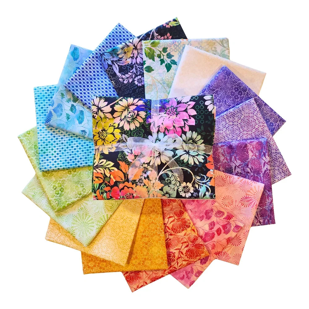 Circular arrangement of colorful fabric swatches featuring vibrant floral designs with a bundle tied with a white ribbon in the center.