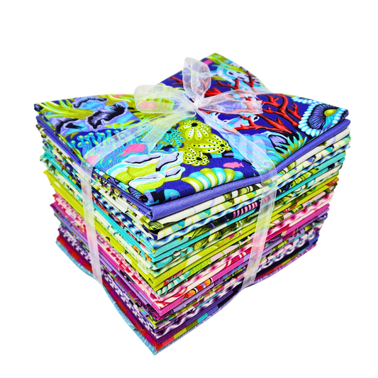 Bundle of colorful fabric squares tied with a ribbon on a white background