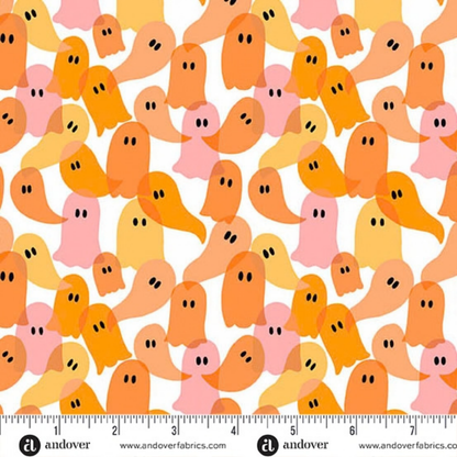 Pattern of colorful orange and peach ghosts on a white background with a ruler for scale