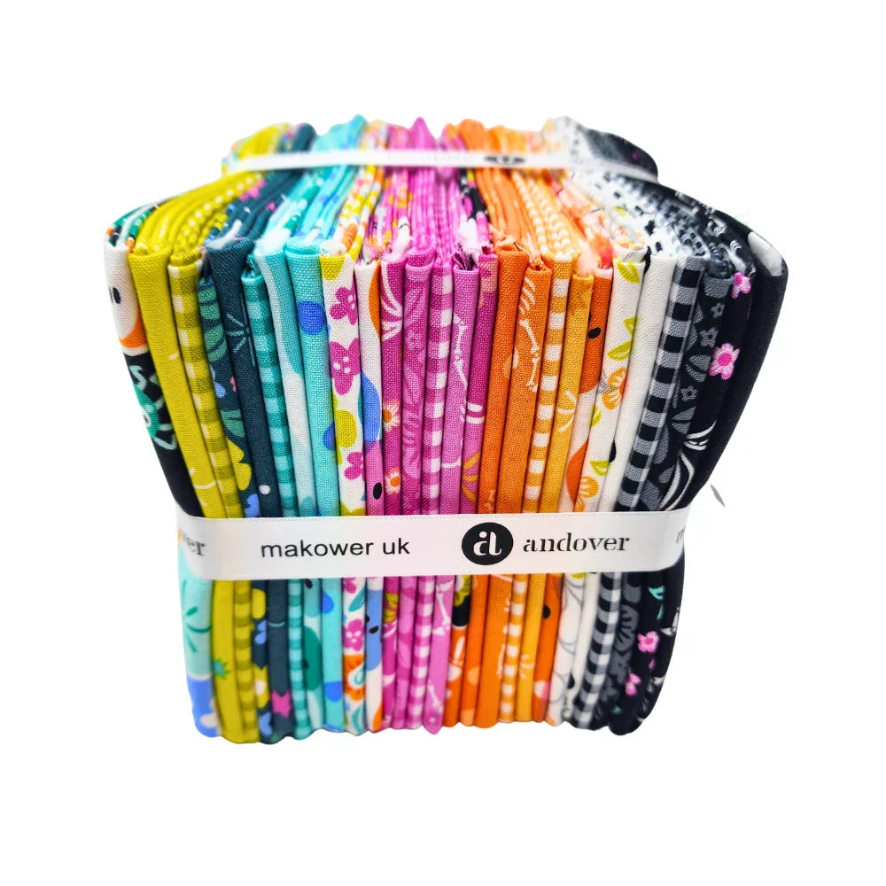 Pack of colorful fabric squares in vivid pinks, oranges, lime-greens, teals, and blacks, featuring Halloween motifs. Wrapped with a white ribbon.