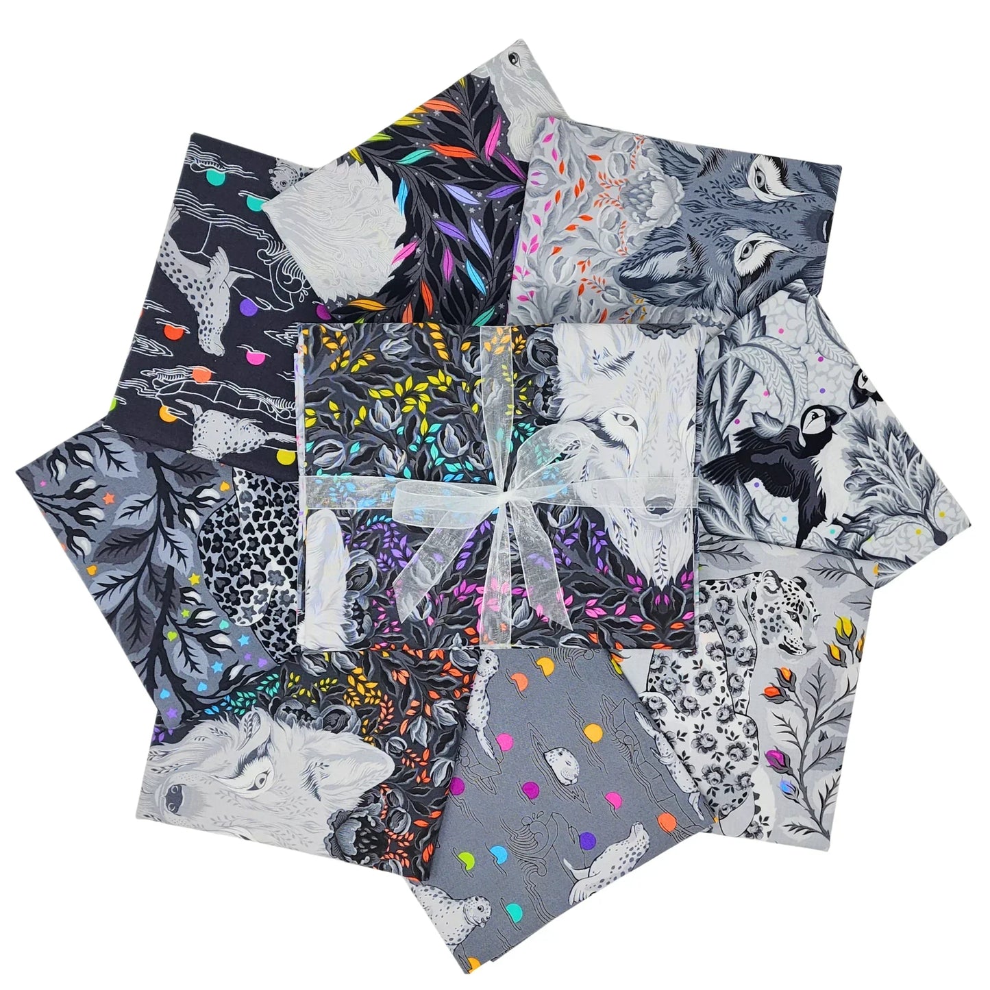 Collection of fabric swatches with animals and floral patterns on a white background