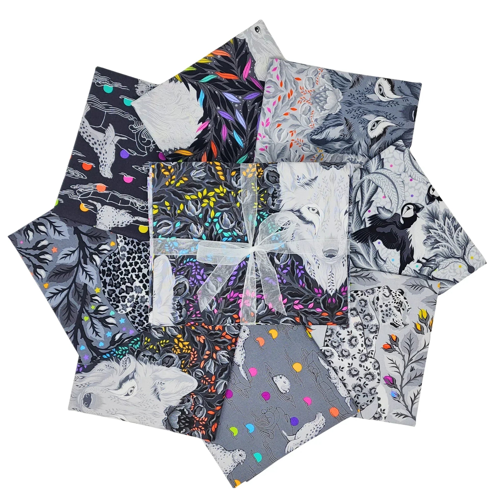 Collection of fabric swatches with animals and floral patterns on a white background