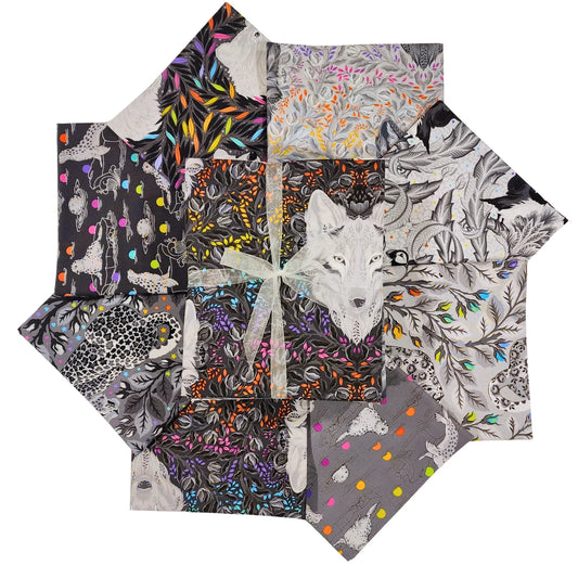 Collection of patterned fabric squares with animal designs on a white background